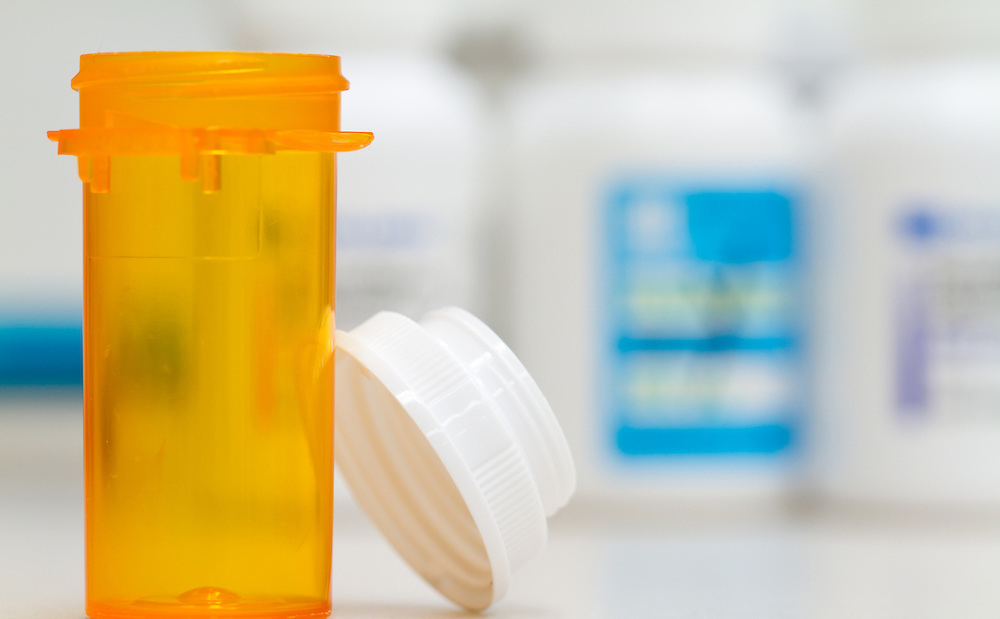 pharmacy pill bottle and cap